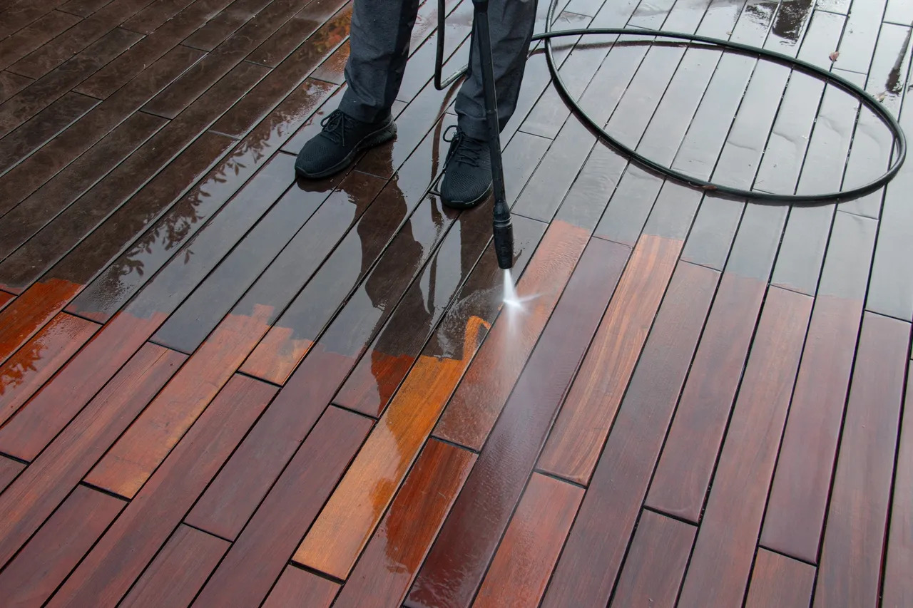 Professional pressure washing stained wooden deck in Albany County, NY